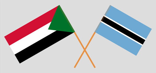 Crossed flags of Botswana and Sudan