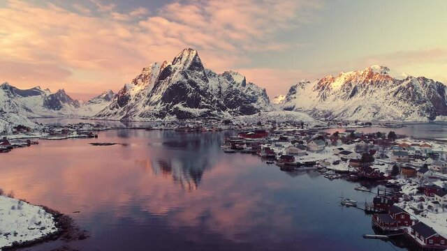 Aerial footage and timelapse over fisherman village in winter time , fjords in Lofoten archipelago in northern Norway 