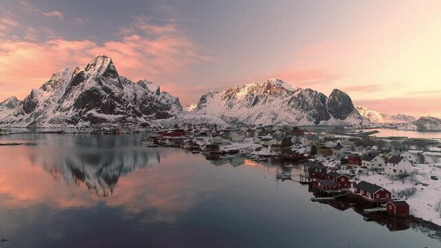 Aerial footage and timelapse over fisherman village in winter time , fjords in Lofoten archipelago in northern Norway 