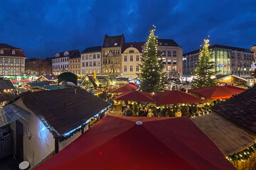 Gottingen, Germany. Christmas market at Market Square in dusk. Panoramic view from Old Town Hall.