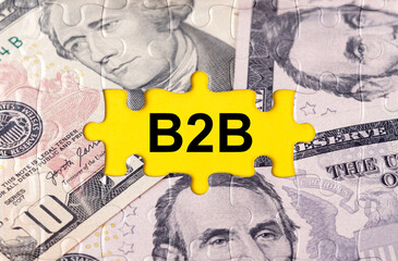 Puzzle with the image of dollars in the center of the inscription -B2B