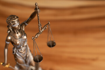 law symbol justice figure on wood table