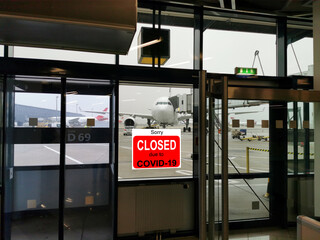 Business center closed due to COVID-19, sign with sorry in door window. Stores, restaurants, offices, other public places temporarily closed during coronavirus pandemic. Economy hit by corona virus