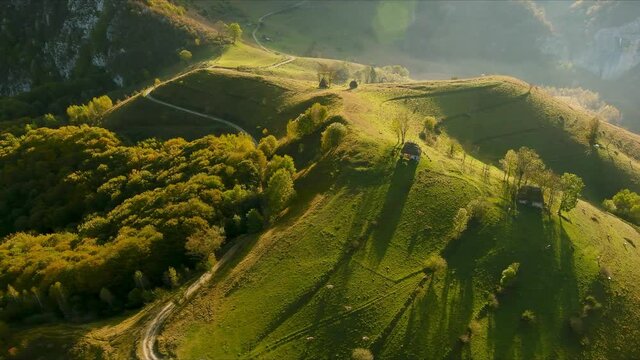Aerial drone footage over Transylvanian village in Romanian Carpathian mountains , Romania landscape 