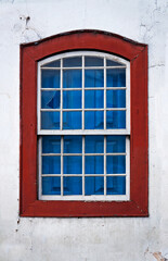 Fototapeta na wymiar Colonial window in historical city of Diamantina, Brazil