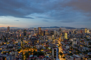 Aerial panoramic view of Mexico City, CDMX, and its skyline during the Golden Hour.