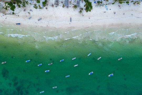 Aereial top down view of some fisherboats moored on Tulum Beach in Quintana Roo, México.