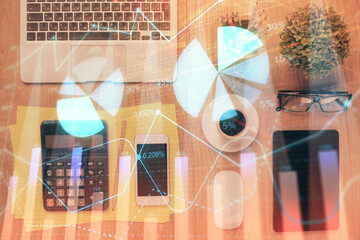 Double exposure of forex chart hologram over desktop with phone. Top view. Mobile trade platform concept.