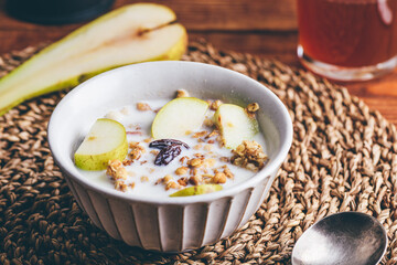 Delicious Granola with Pear and Raisins In Bowl