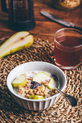 Homemade Granola with Fresh Pear In Bowl