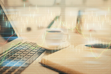 Fototapeta na wymiar Double exposure of financial chart drawing and desktop with coffee and items on table background. Concept of forex market trading