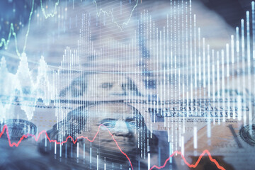 Double exposure of forex graph drawing over us dollars bill background. Concept of financial markets.