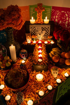 Candles, flowers and skulls on "ofrenda" for the Day of the Dead