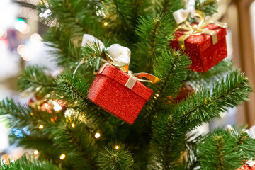 Fototapeta na wymiar mini giftbox red festive decor christmas decoration christmas tree background festive