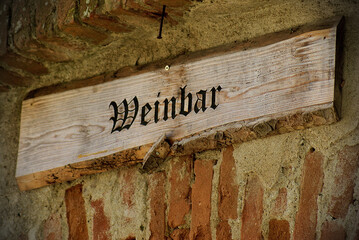 Wooden nameplate with an old font writing 