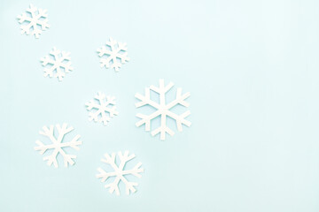 Snow flakes made from cut out paper. A simple concept of minimalist holidays.