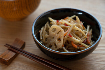 Kinpira burdock on a wooden background
