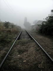 Fototapeta na wymiar railway in the fog