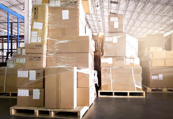 Cargo shipment boxes. Stack of cardboard boxes on pallet rack at the warehouse storage. Manufacturing and warehousing. 