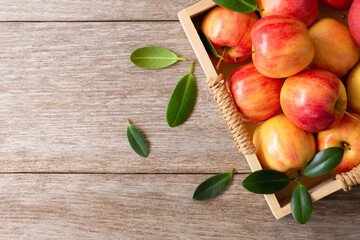 apple with leaves on table