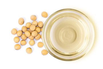 Soy bean oil in glass bowl and soybeans isolated on white 