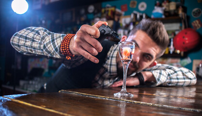 Barman creates a cocktail on the taproom