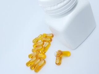 Fish oil capsules and bottle