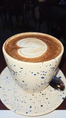 cup of coffee on wooden table