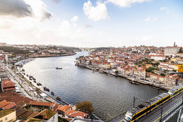 Douro River overlooking the lower city of Porto in Portugal. Bridge with train