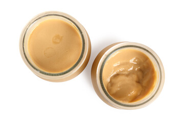 Milk pudding dessert in jars. Isolated with clipping path. Direc