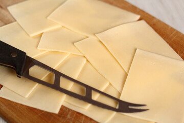 Cheese slices and knife