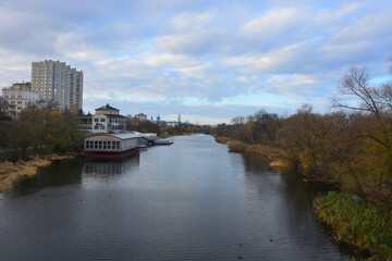 Obraz premium Autumn landscape . The photo was taken on the bridge over the river .