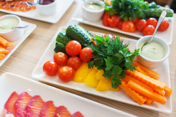 Fresh vegetables cut into strips with sauce and herbs are a treat for guests of the event