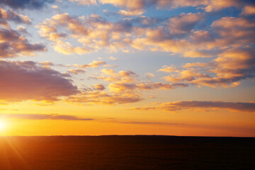Fototapeta na wymiar Spectacular colorful sunset with cloudy sky.