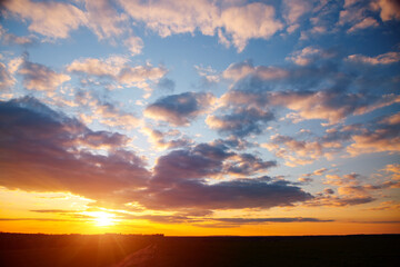 Spectacular colorful sunset with cloudy sky.