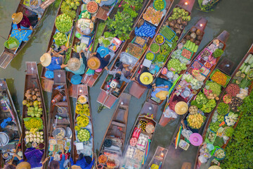 Damnoen Saduak Floating Market or Amphawa. Local people sell fruits, traditional food on boats in...