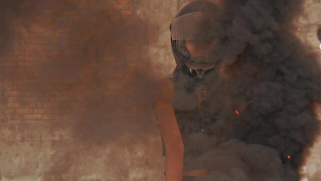 slow motion medium shot woman biker posing looking camera waving black smoke grenade