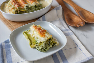 Cannelloni with ricotta and spinach. Italian cuisine. 