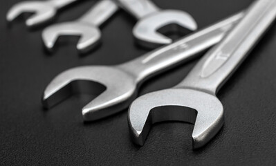 Wrenches on a black background. Close up.