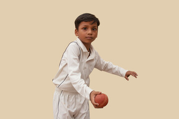 A boy Delivering a spin ball During a Cricket Game