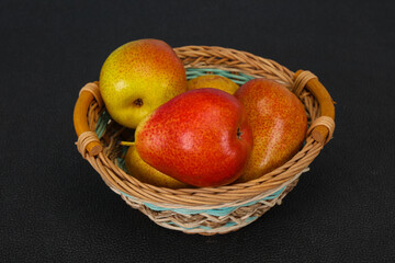 Pear heap in the wooden basket