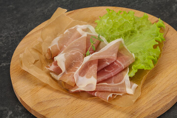 Italian prosciutto pork meat over board