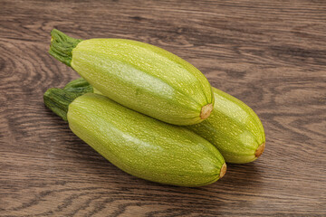 Young tasty zucchini over board