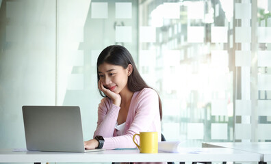 Portrait businesswoman using laptop for work on work space.