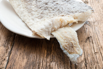 Slice of raw salted codfish