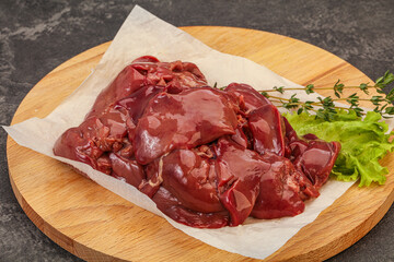 Raw chicken liver over board