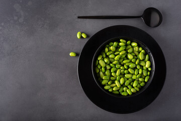 Japanese green beans in a black bowl