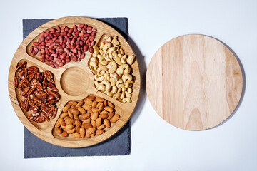 Healthy mix of nuts. Pecans, Cashews, almonds, peanuts, pine nuts, walnuts, hazelnuts. copy space