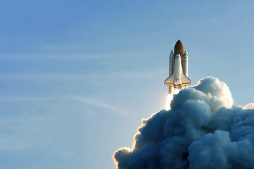 The launch of the space shuttle against the background of the sky and smoke. Elements of this image furnished by NASA - Powered by Adobe