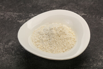 Wheat flour heap in the bowl